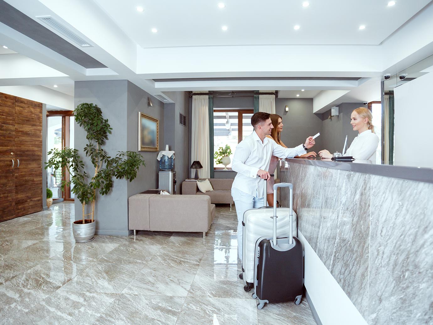 Man checking into the hotel at reception